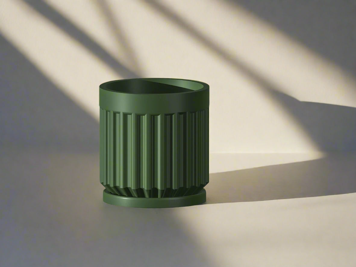 Modern fluted 3D printed planter with drainage and tray in black, white, beige. Sizes 4–11 inches.”