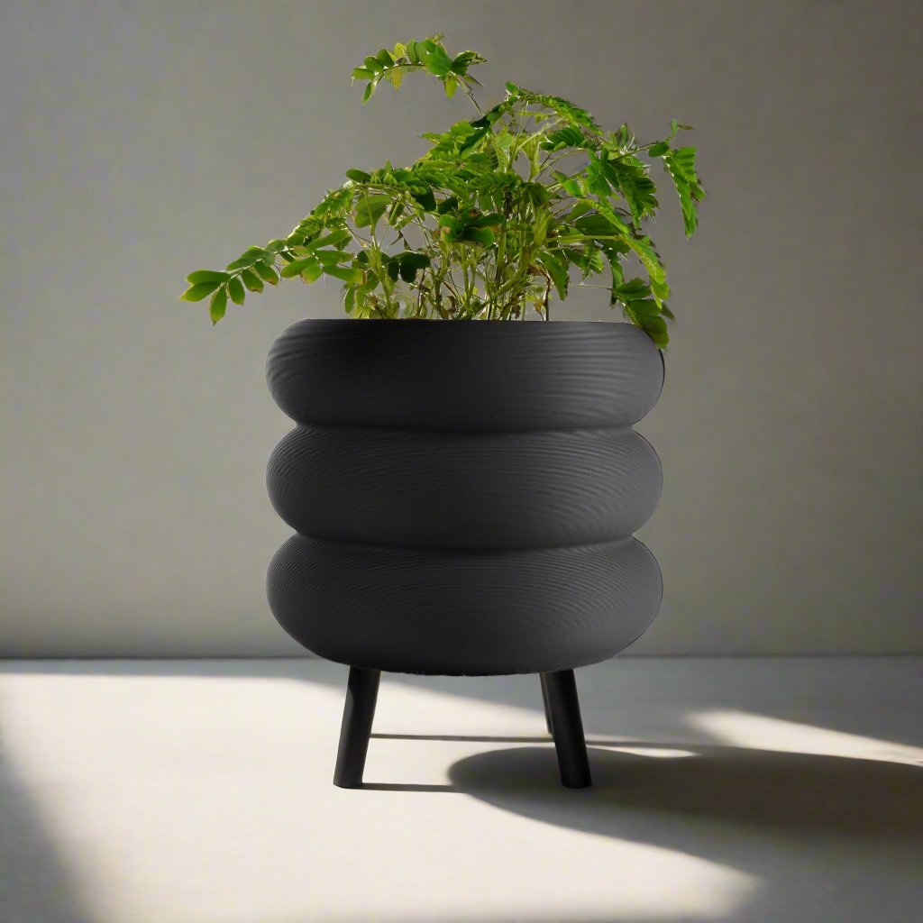 Bubble Planter/Donut Planter with Drainage in a sleek black matte finish, featuring a whimsical donut-like design and excellent drainage, perfect for enhancing any home decor with a touch of modern minimalism and vibrancy for plant lovers.