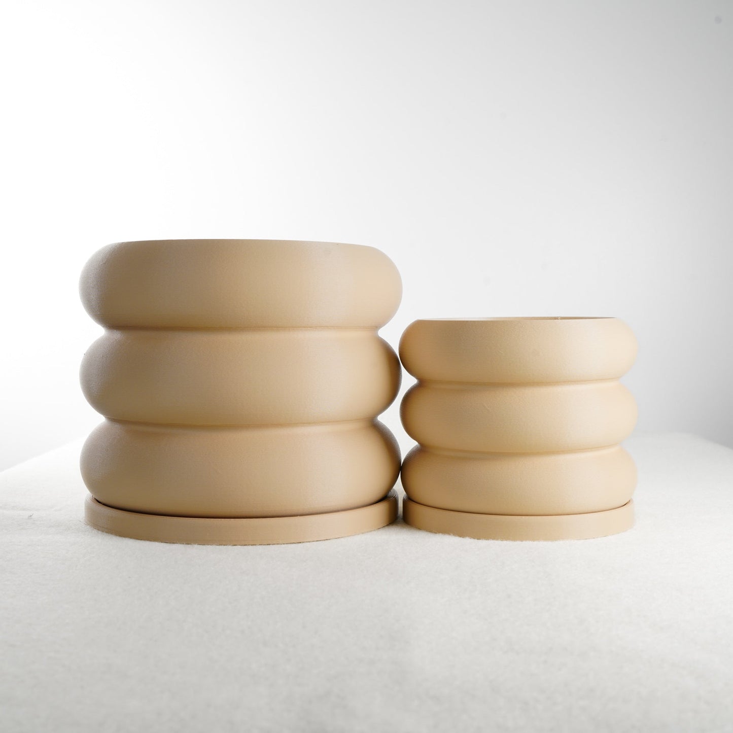 Bubble Planter/Donut Planter with Drainage in modern matte beige finish, featuring a playful stack of donut-like contours, excellent drainage system, and matching drip tray. Perfect for plant lovers looking to enhance their home decor with unique, breathable, and stylish planters available in multiple colors.