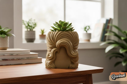 Beige sculptural wig planter with oversized flowing hair design holding a succulent in a modern plant-filled room